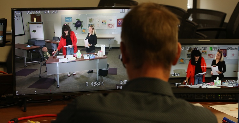 PDP Media Staff editing a video.